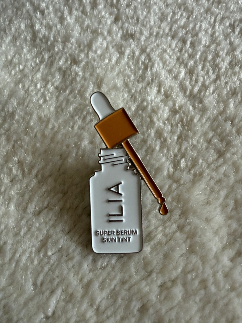 Ilia Serum Foundation shaped Pin